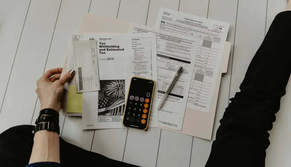 A budget review with a calculator and financial planning notes